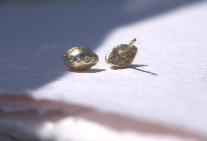 diamond gold studs pictured on natural white background, handmade fine jewellery by Madeleine.