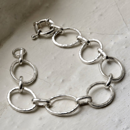 sterling silver diamond bracelet pictured on white brick in the cotswolds, handmade fine jewellery by madeleine.