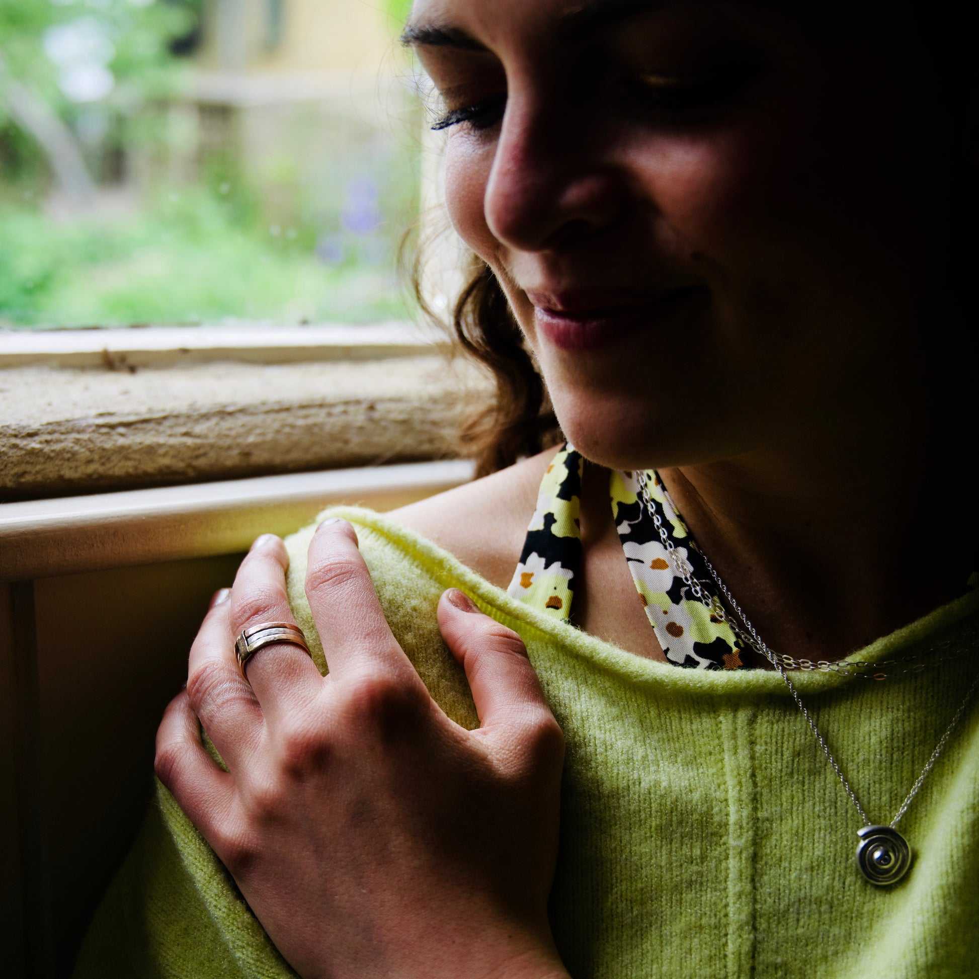 Madeleine wearing the diamond silver spiral necklace in the Cotswold's. Handmade fine jewellery.